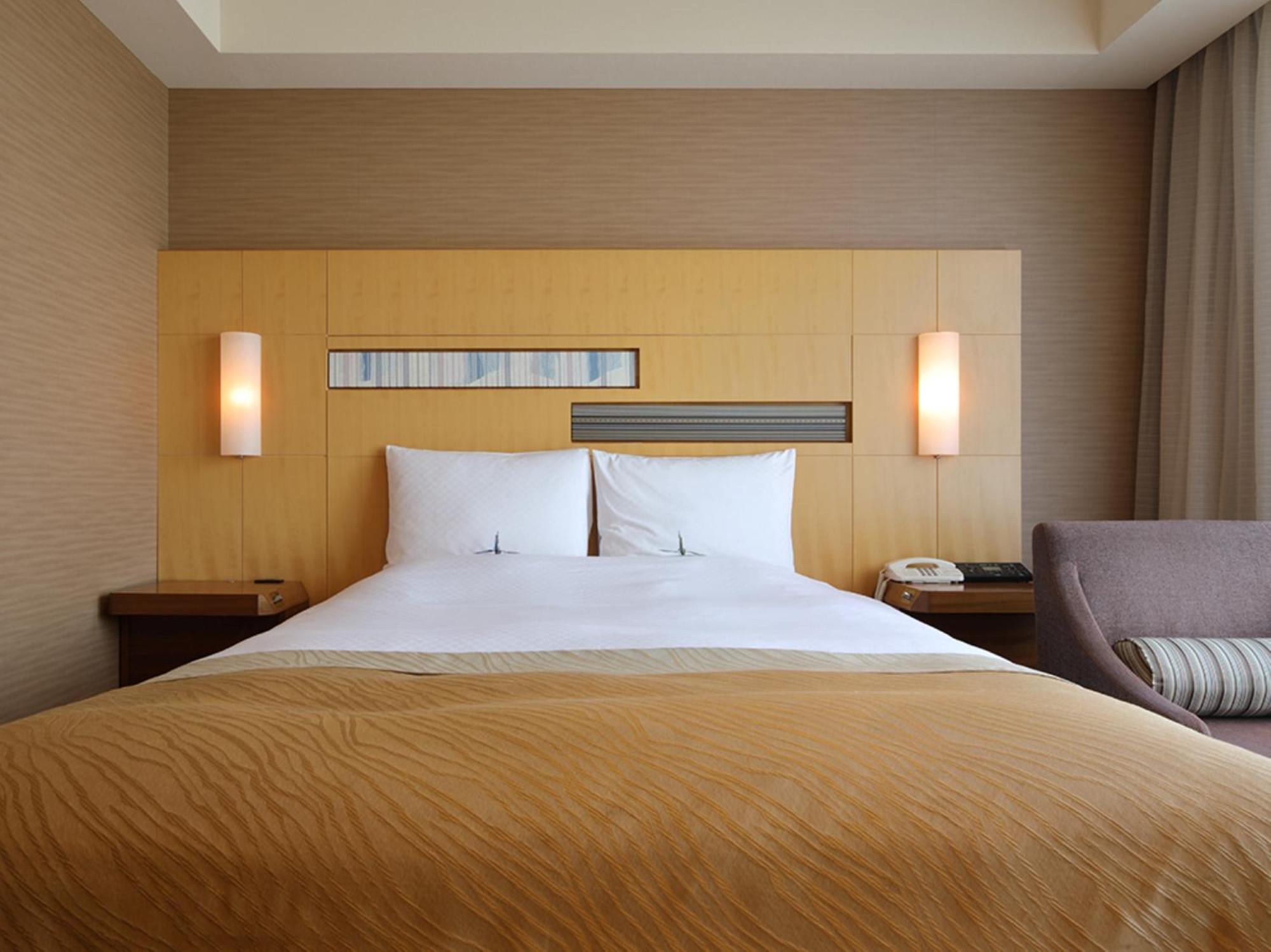 โรงแรมโอคุระ ฟูกูโอกะ ฟูกุโอกะ ภายนอก รูปภาพ A bedroom